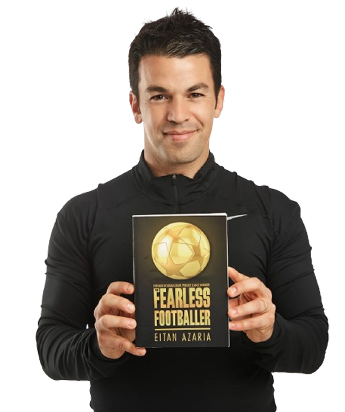 Eitan Azaria holding Fearless Footballer book